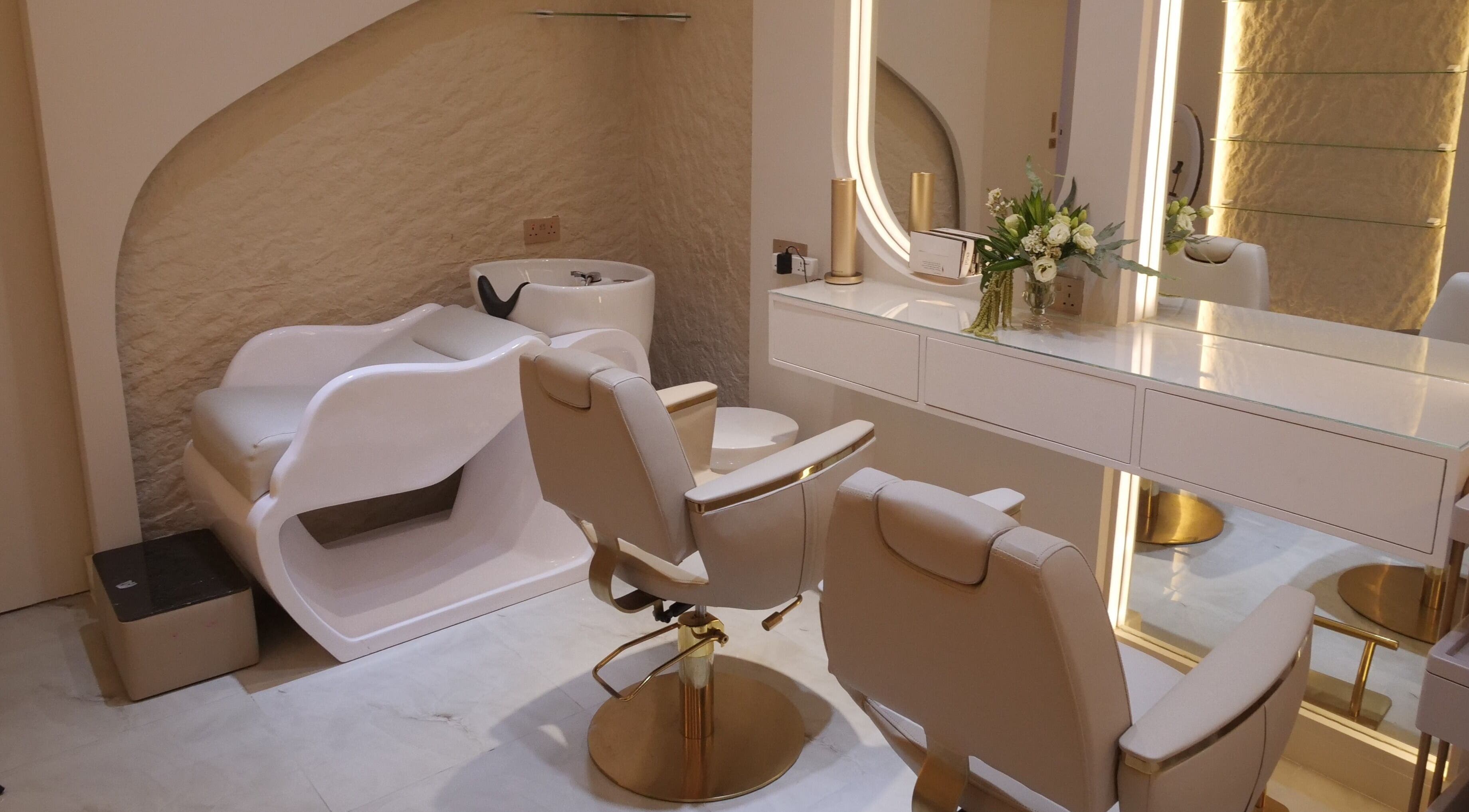 Sophisticated hair station at Resolve Hair, Dubai, Dubai, AE with modern chairs and sleek design.