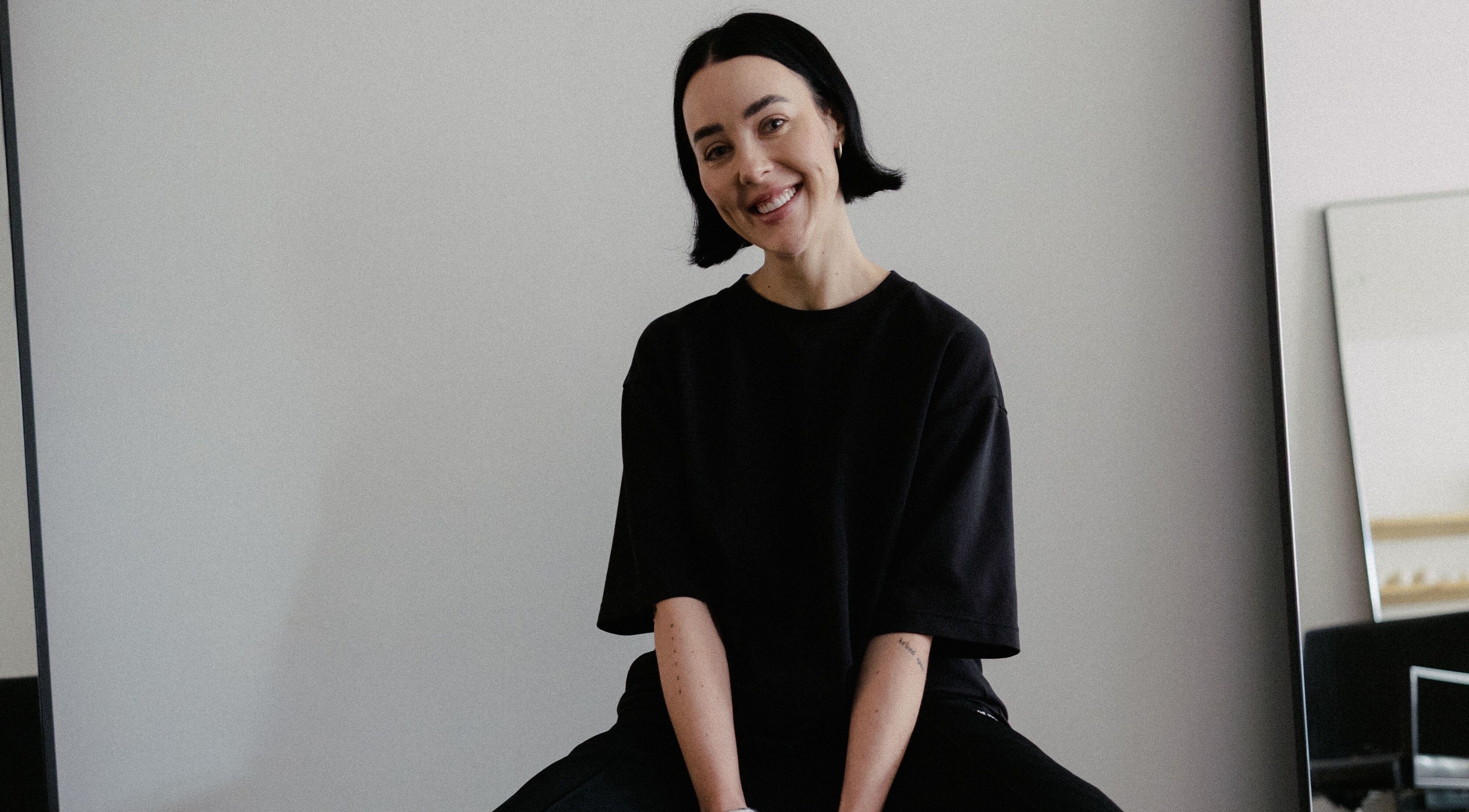 Smiling stylist at Vandermeer Hair in Surry Hills, New South Wales, AU, ready to transform hair.