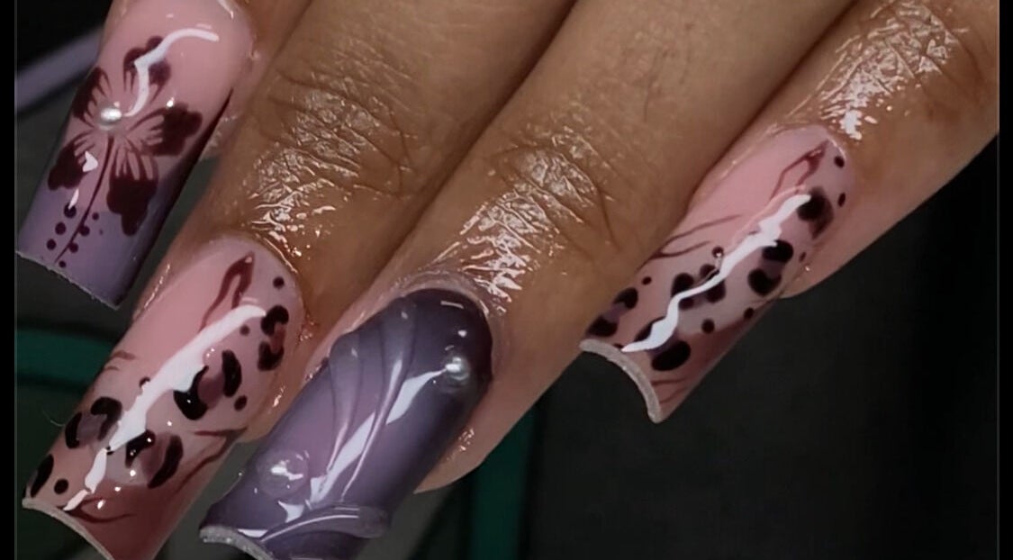 Elegant nail art featuring floral designs at Velvet Varnish Lounge, Spring, Texas, US.