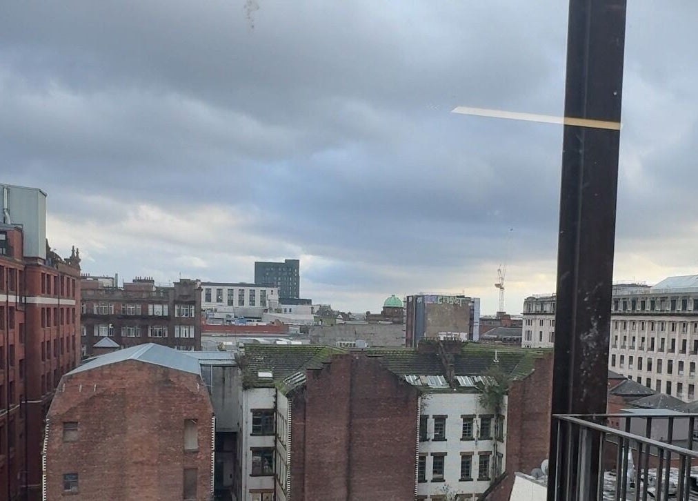 View from PrioriTEA Brow & Lash Co. in Glasgow, Scotland, GB, showcasing a cityscape with historic buildings.