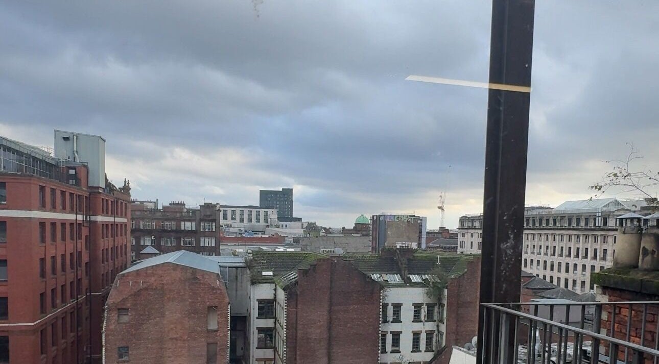 View from PrioriTEA Brow & Lash Co. in Glasgow, Scotland, GB, showcasing a cityscape with historic buildings.