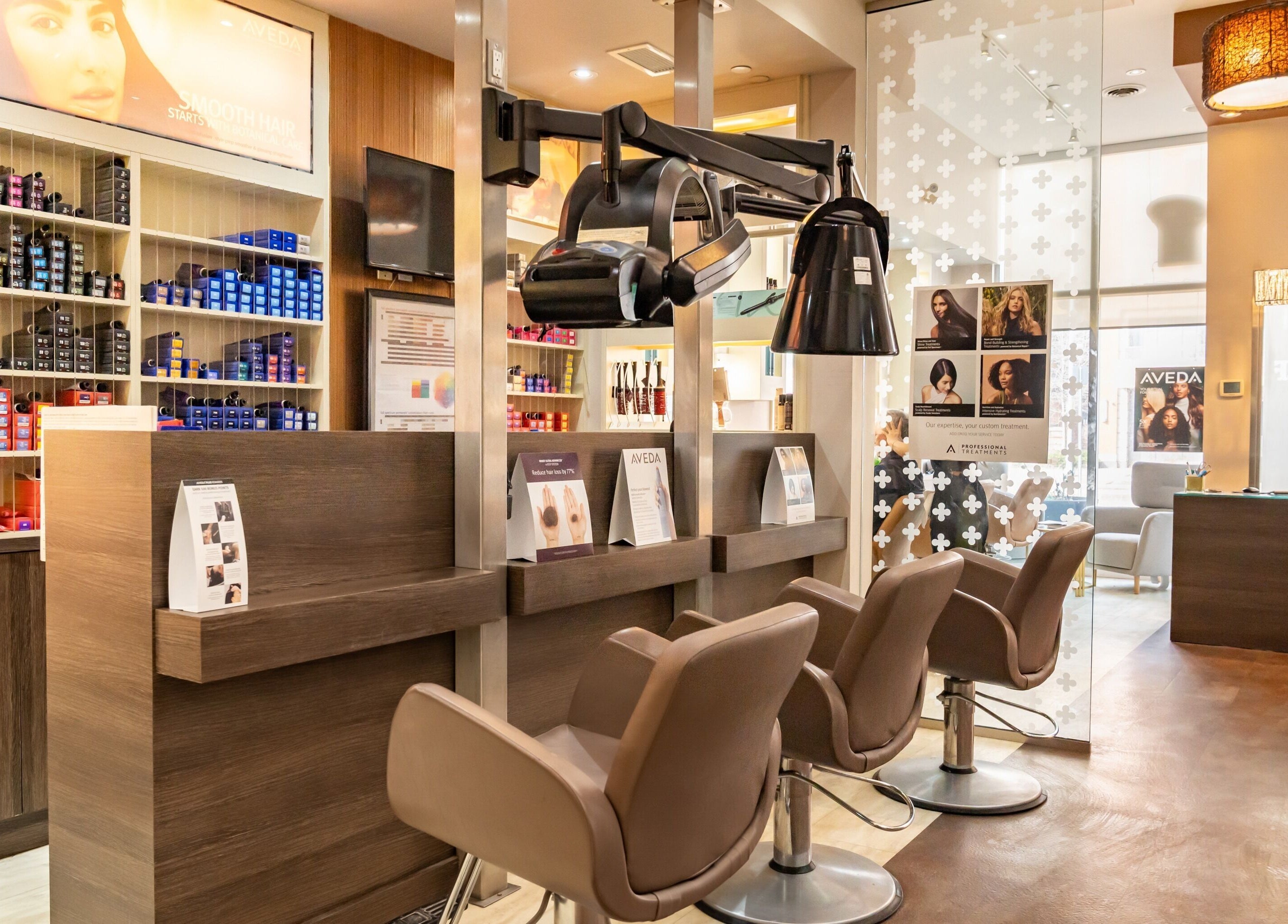 Modern salon chairs at Pure Self Salon N Spa | AVEDA Salon, Markham, Ontario, CA with sleek interior design.