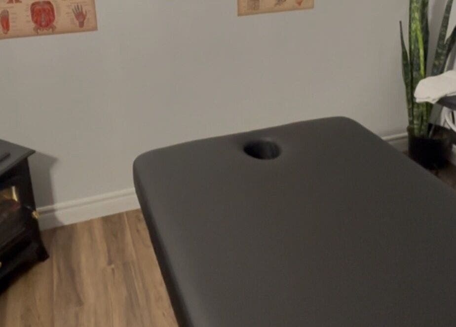Massage room at Jaiye Health Centre - Ajax Thai Massage, Ajax, Ontario, CA with table, plant, and heater.