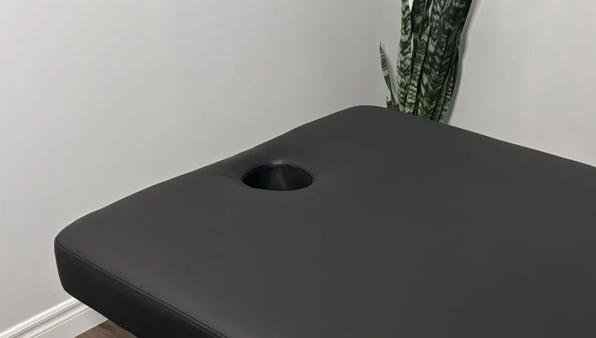 Massage table at Jaiye Health Centre - Ajax Thai Massage in Ajax, Ontario, CA provides comfort for relaxation.