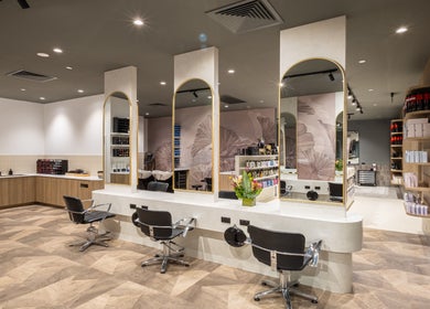 Stylish interior of Jts Rockingham salon, Rockingham, Western Australia, AU featuring modern styling stations.