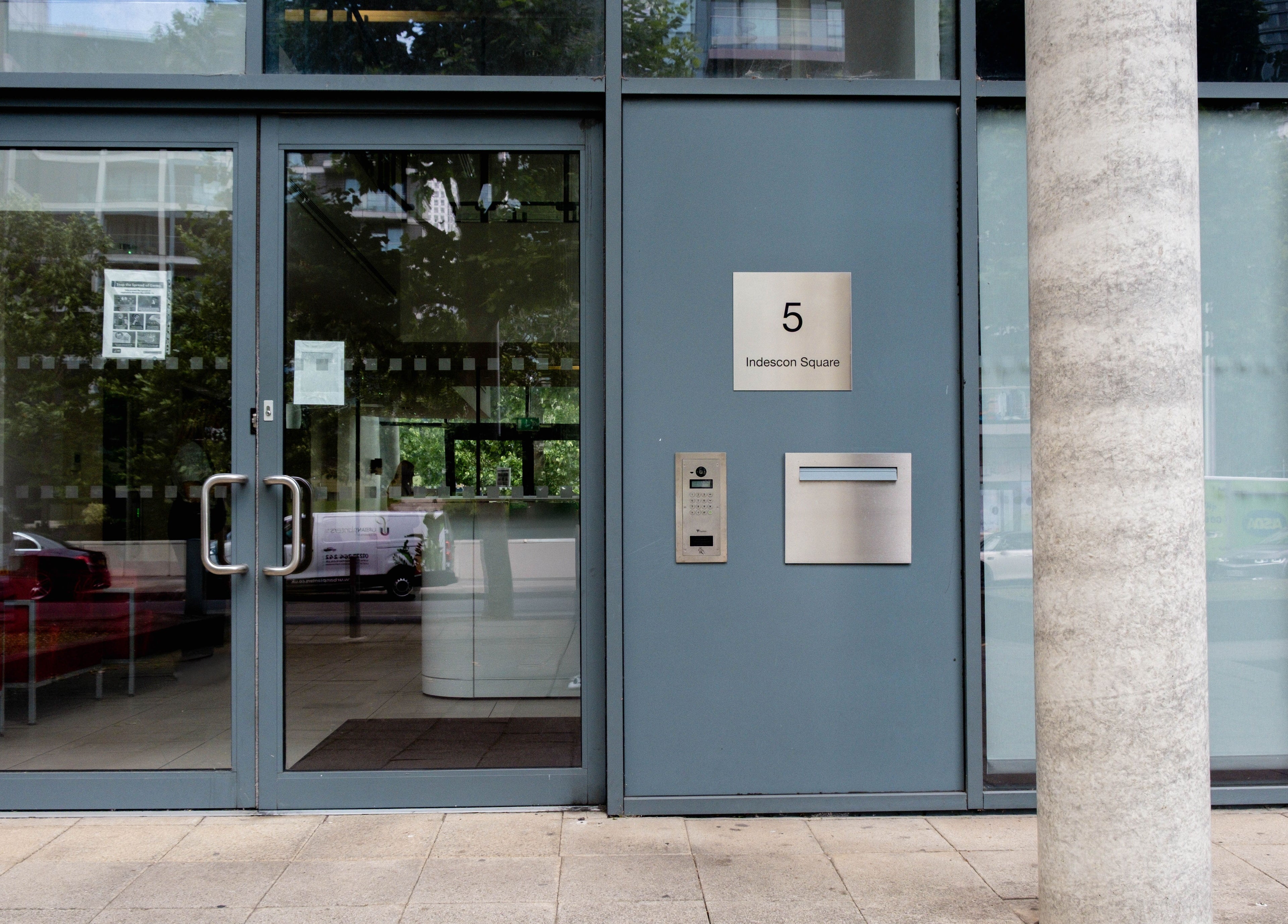 Entrance of Fazara Aesthetics at 5 Indescon Square, London E14 9DQ, England, GB showcasing sleek design.