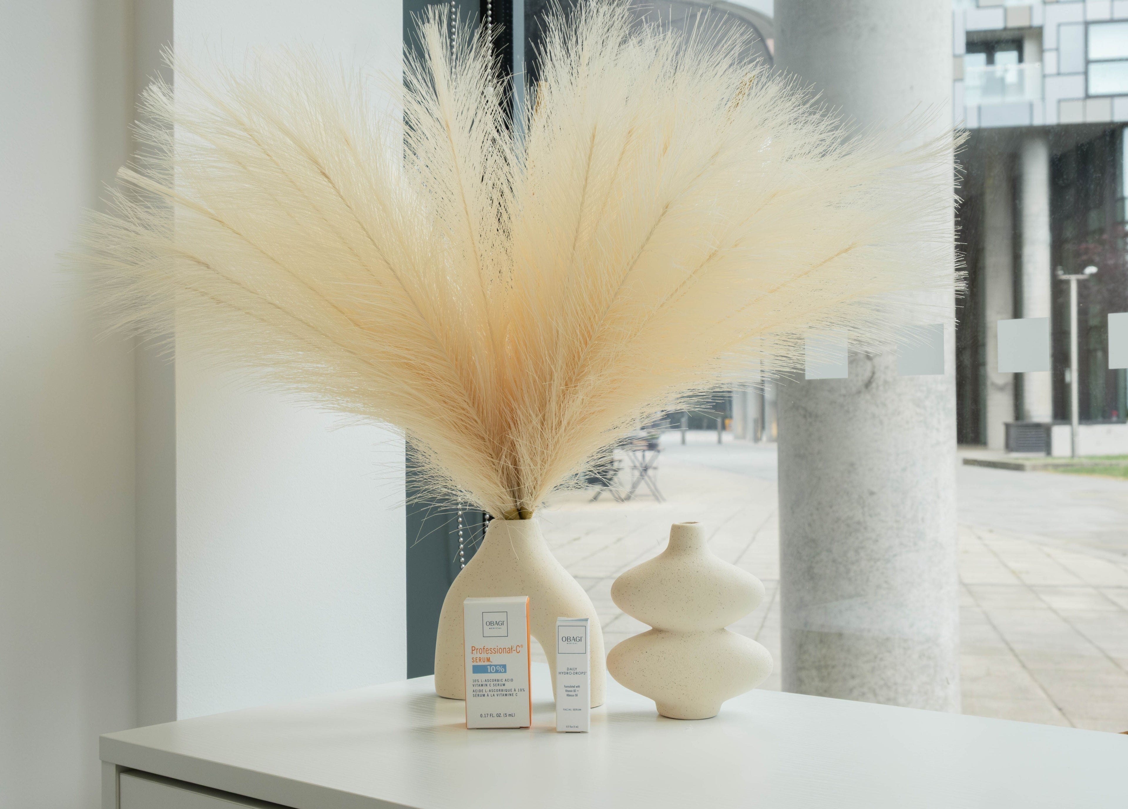 Chic interior decor with vases and products at Fazara Aesthetics in London E14 9DQ, England, GB.