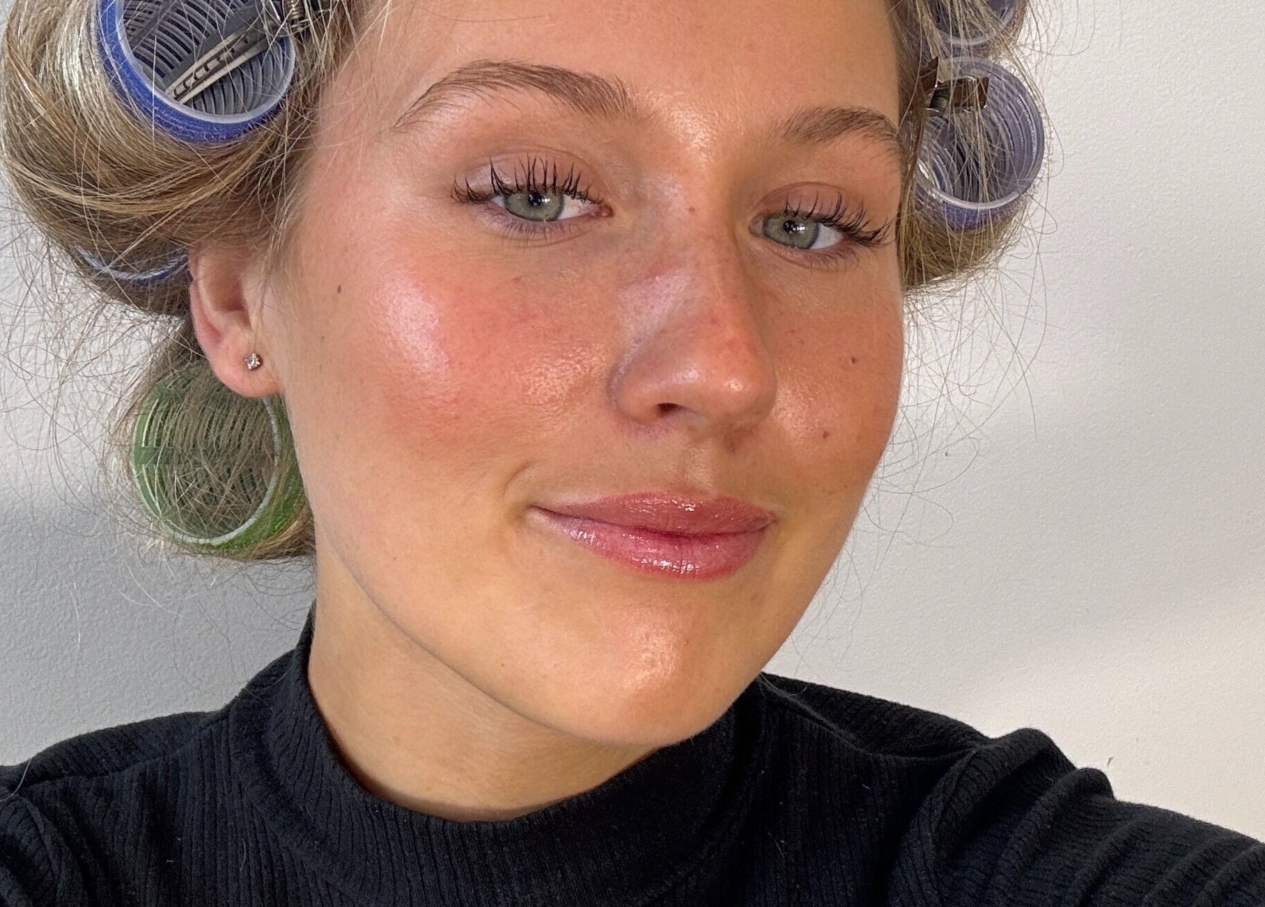Person with curlers in hair at Blondelle Club, Albury, New South Wales, AU, showcasing a beauty treatment.