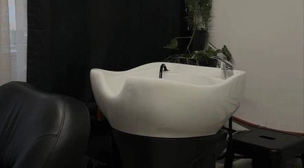 Chic hair wash station at Esthetika Studio, Baulkham Hills, New South Wales, AU. Sleek design with greenery accents.
