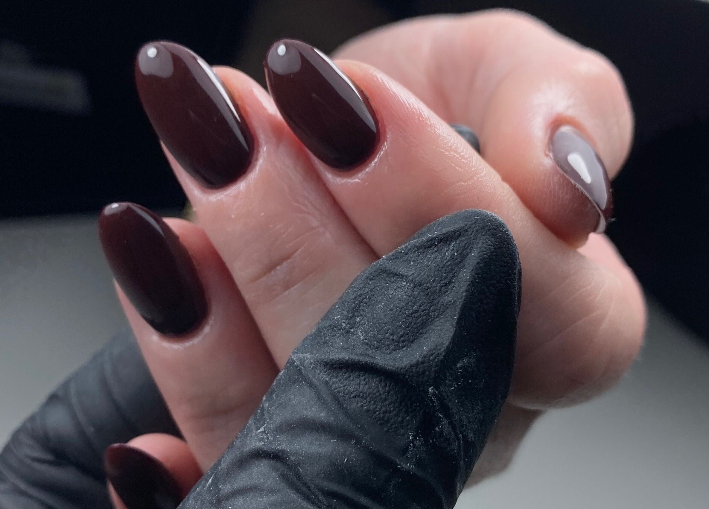 Sophisticated dark manicure at The Gel Society, Southport, Queensland, AU, showcasing fine nail art.