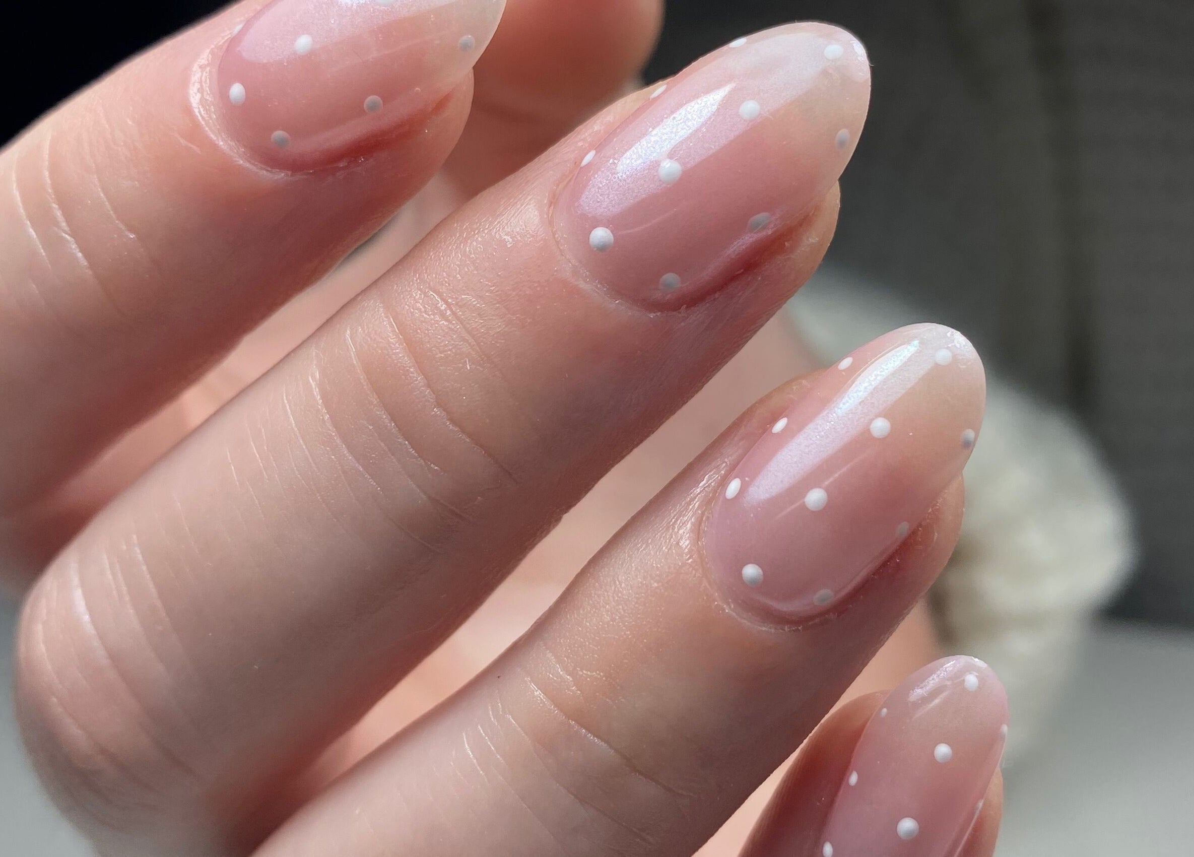 Stylish polka dot manicure at The Gel Society, Southport, Queensland, AU showcasing elegant nail art.