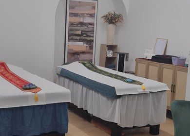 Therapy room at Chantara Thai Massage in Norwich, England, GB, featuring twin massage tables with elegant decor.