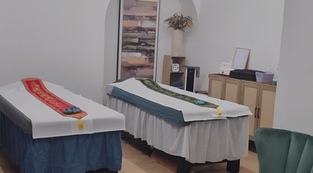 Therapy room at Chantara Thai Massage in Norwich, England, GB, featuring twin massage tables with elegant decor.