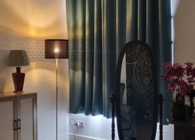 Cozy interior of Chantara Thai Massage with soft lighting and elegant decor in Norwich, England, GB.