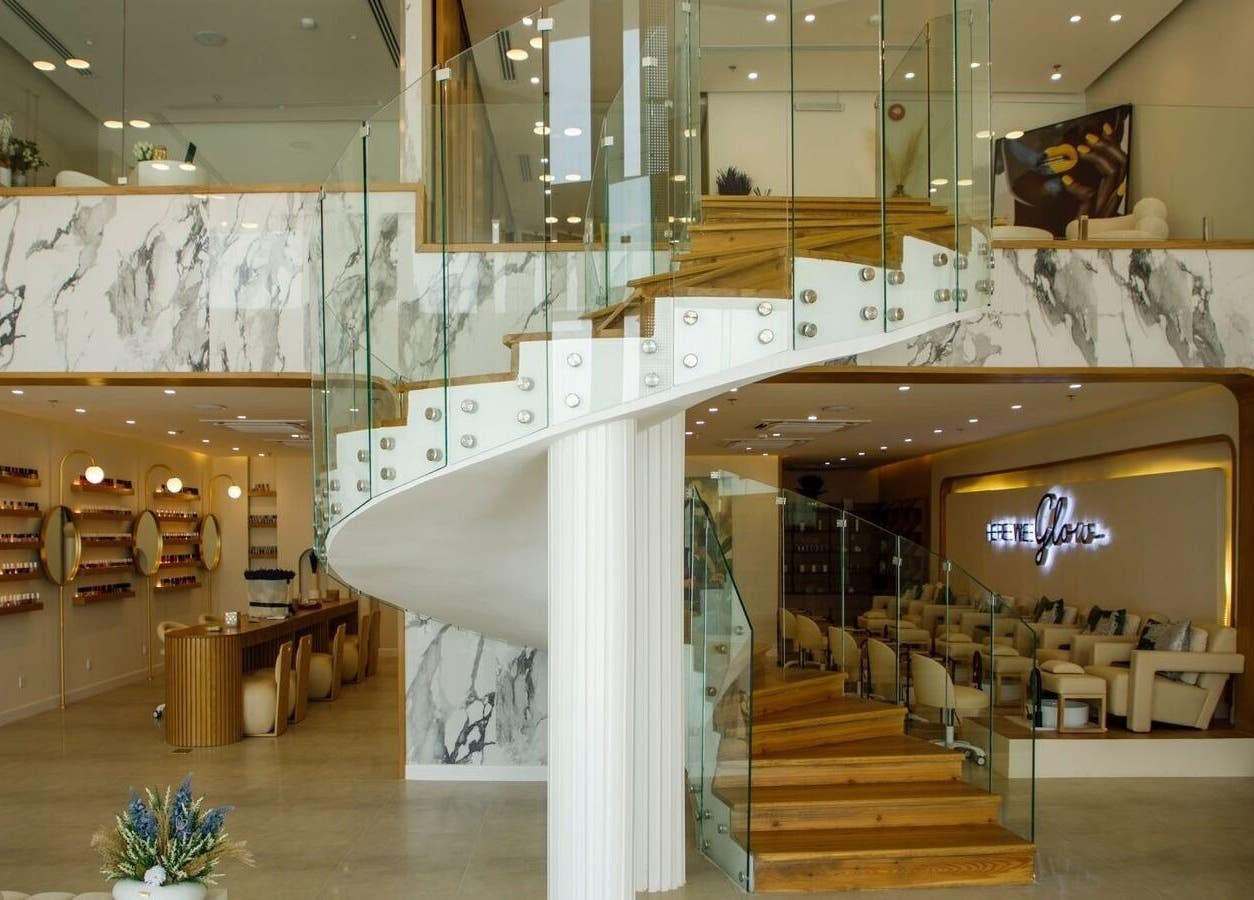 Elegant marble and glass spiral staircase at Spa Al Hana I سبا الهنا, Riyadh, Riyadh Province, SA.