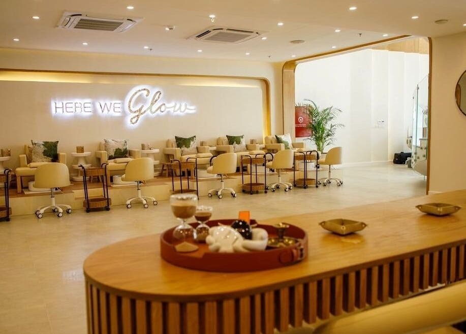 Luxurious nail area at Spa Al Hana I سبا الهنا, Riyadh. Elegant cream chairs and warm lighting.