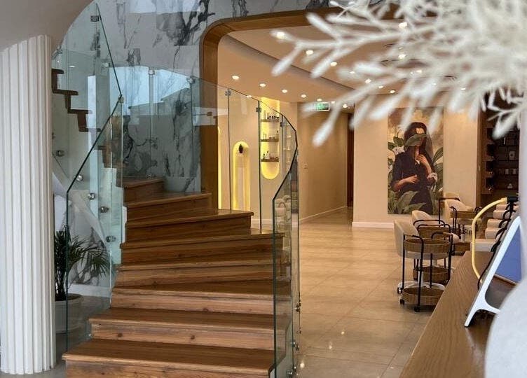 Spiral wooden staircase and modern decor at Spa Al Hana I سبا الهنا, Riyadh, Riyadh Province, SA.