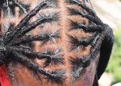 Intricate braid design at Styles By Ethie, Sint Maarten, SX showcasing unique hair artistry.