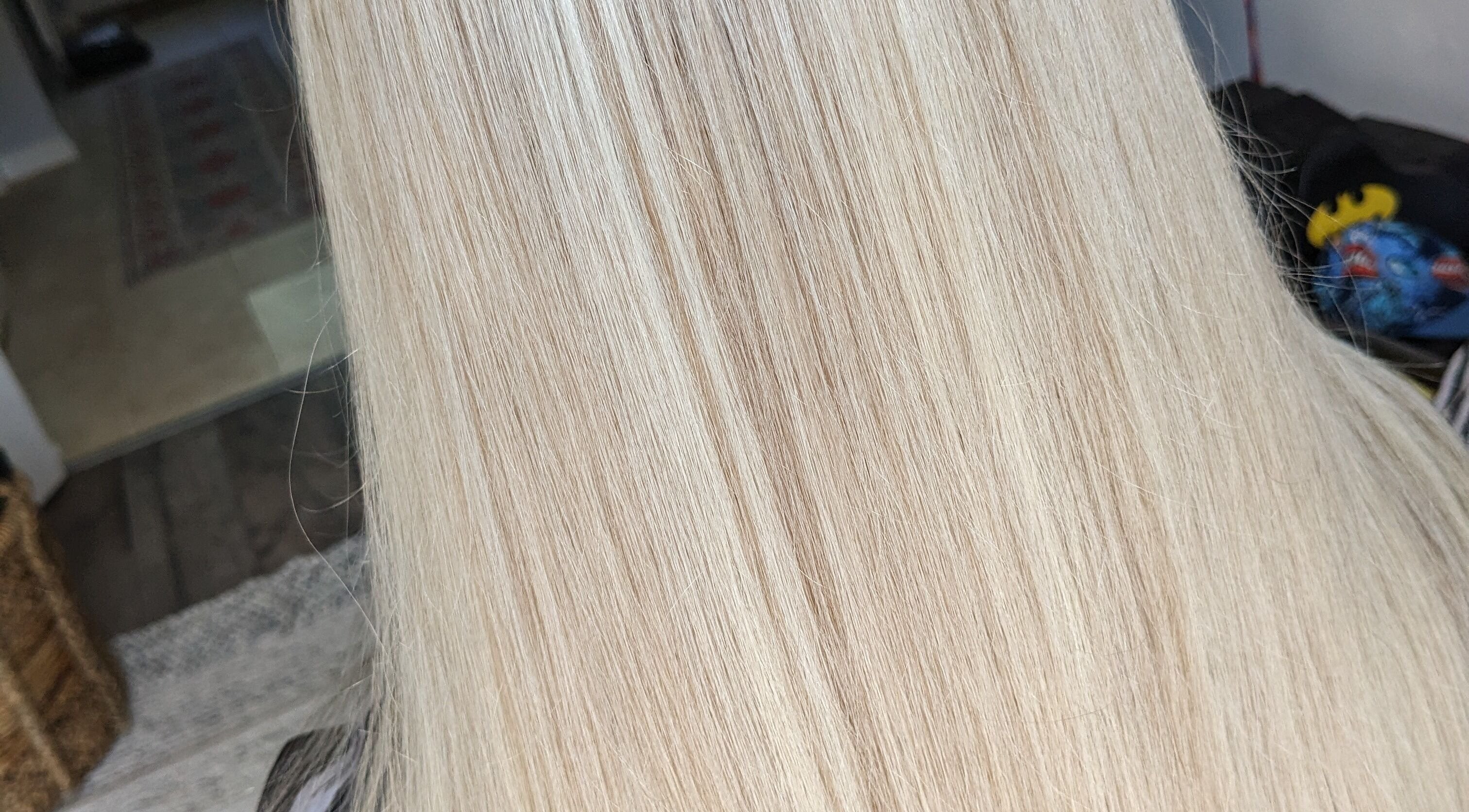 Smooth, silky blonde hair styled by Tracey's Mobile Hairdresser in Nantwich, England, GB.