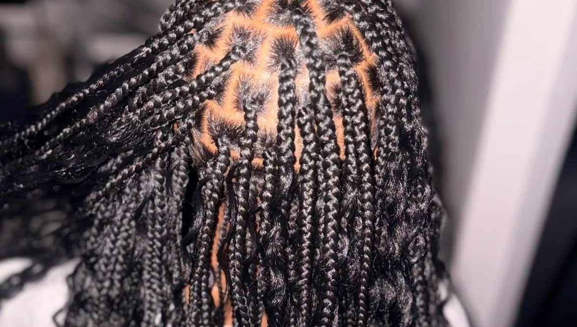 Intricate braided hairstyle at Styled by Kash, Leeds, England, GB showcasing clean patterns and precision.