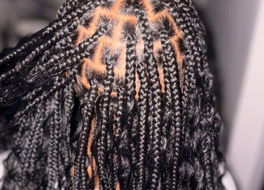 Intricate braided hairstyle at Styled by Kash, Leeds, England, GB showcasing clean patterns and precision.