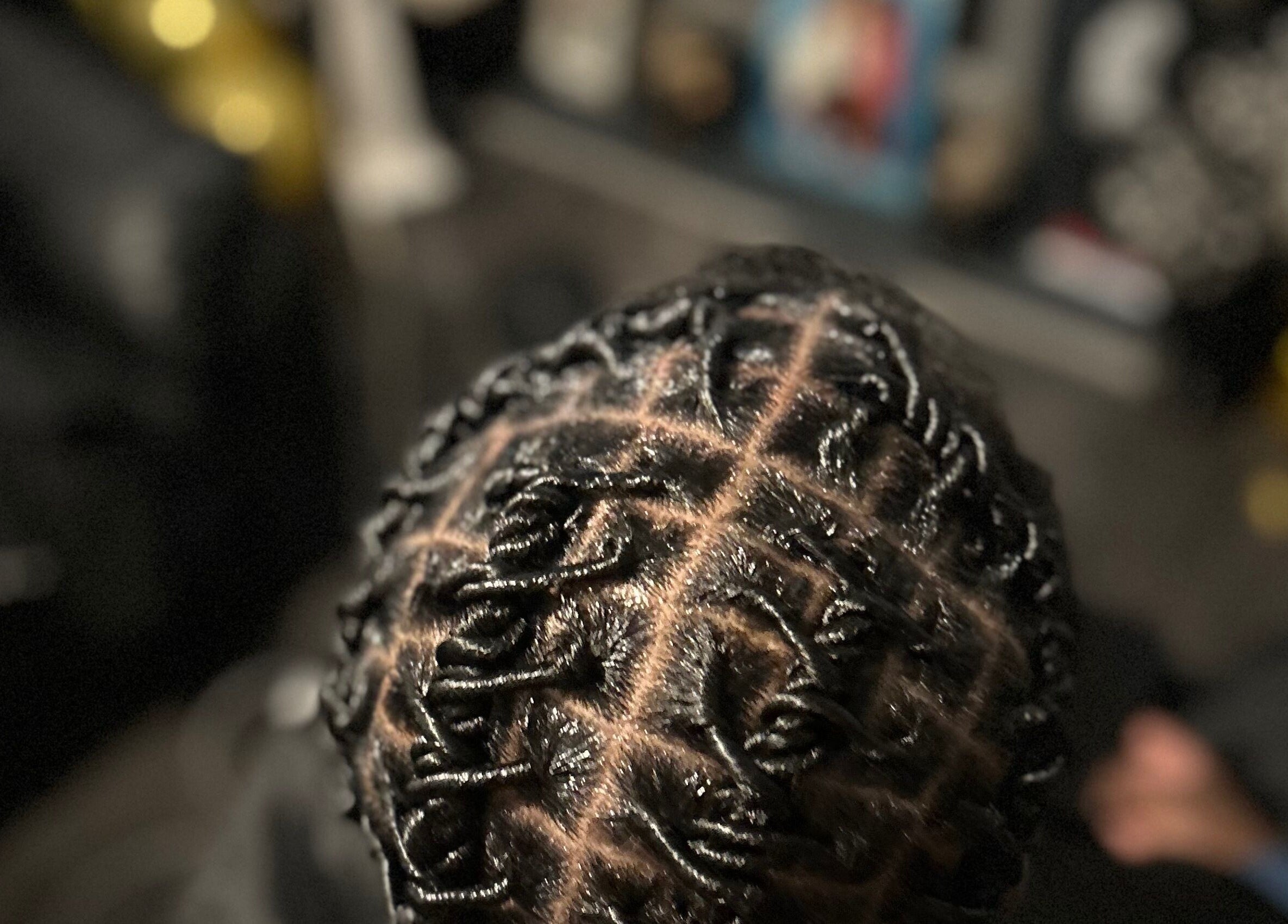 Intricate braided hairstyle at Styled by Kash, Leeds, England, GB.