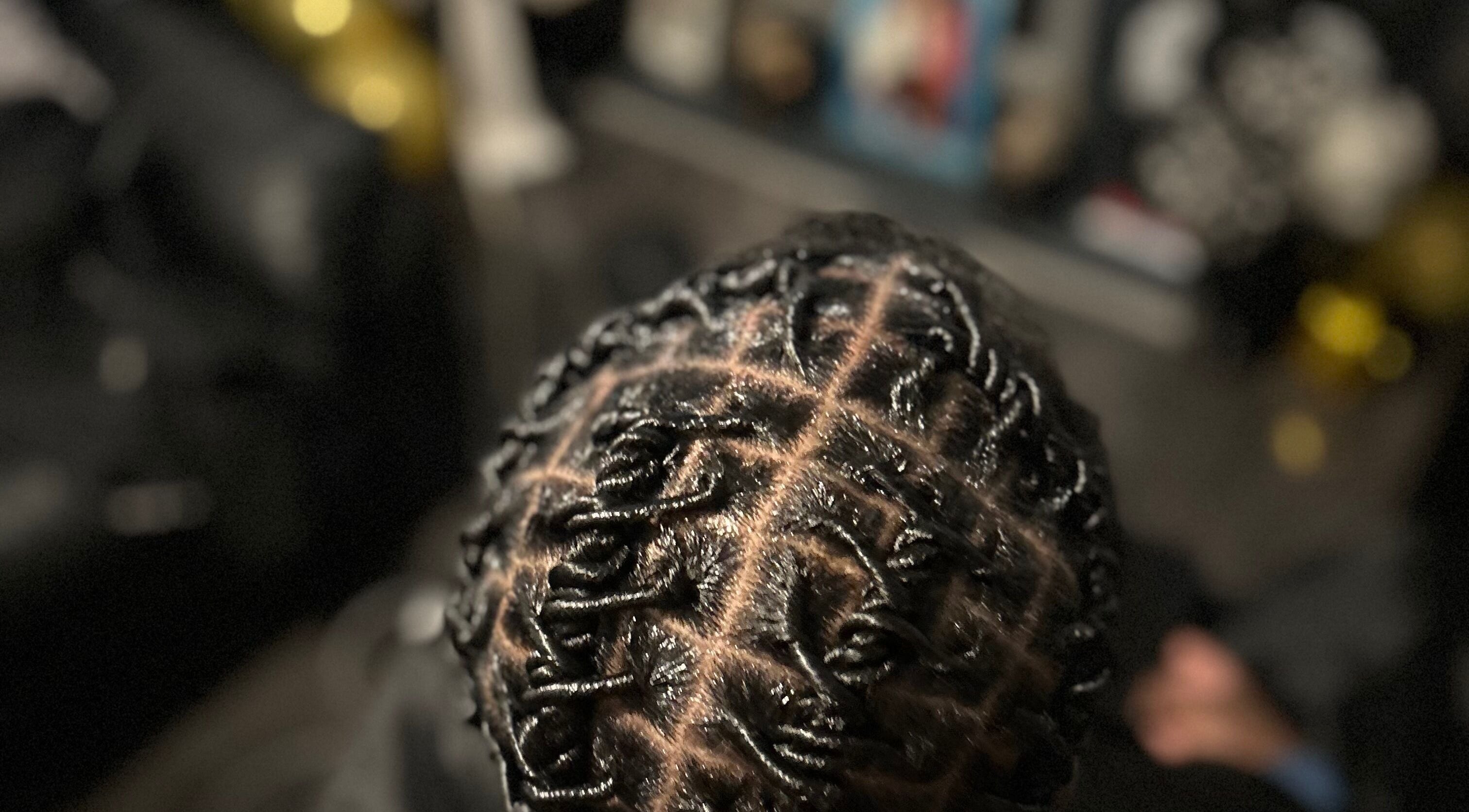 Intricate braided hairstyle at Styled by Kash, Leeds, England, GB.