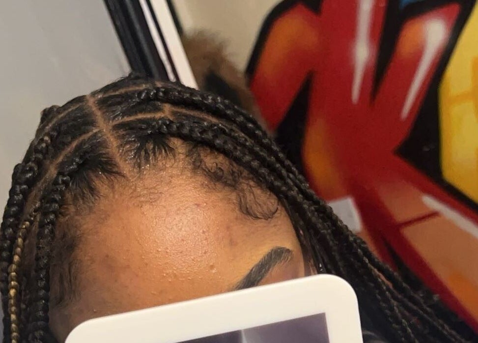 Intricate braids styled at Styled by Kash in Leeds, England, GB, showcasing expert hair design.