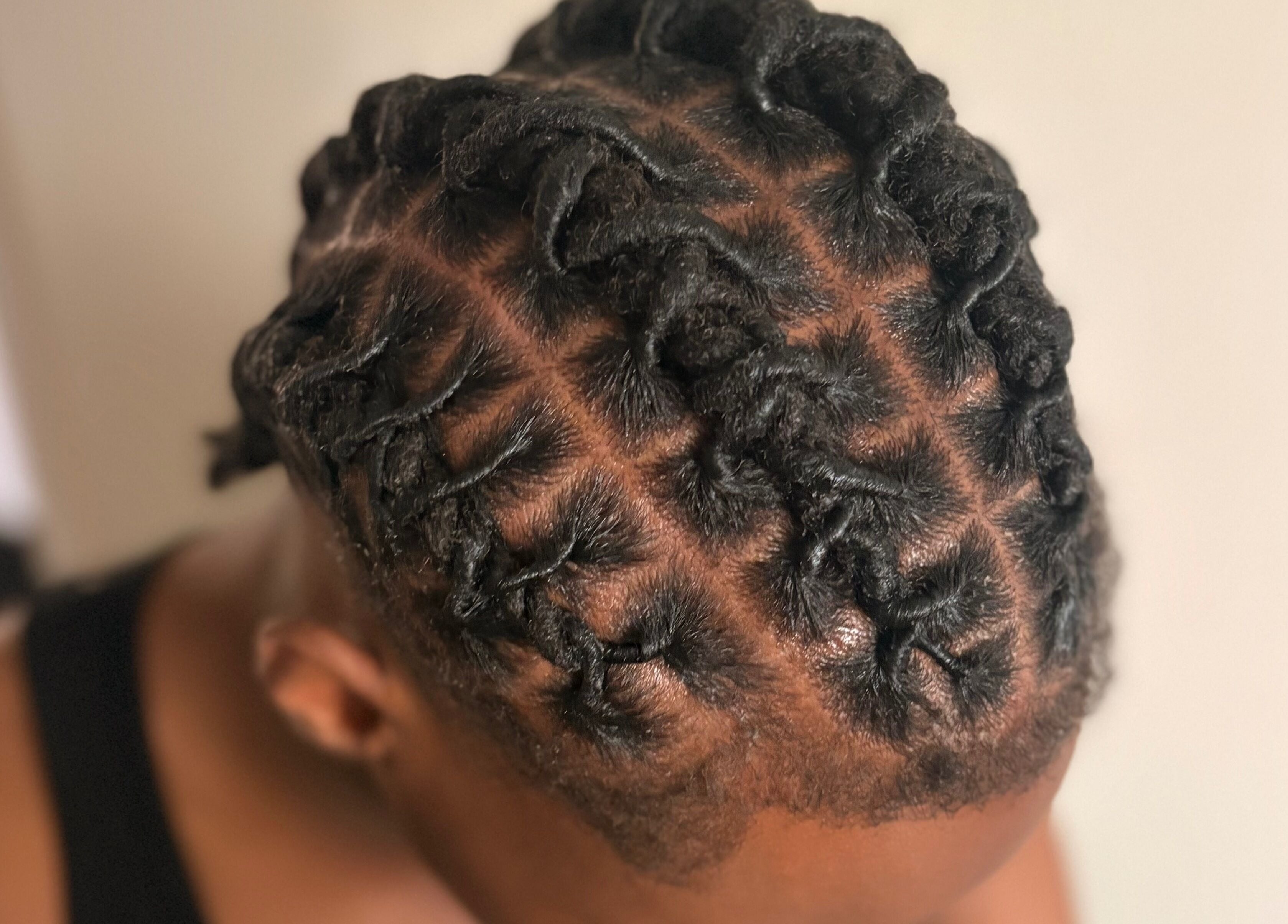 Stylish intricate braids by Styled by Kash in Leeds, England, GB showcasing expert hair design.