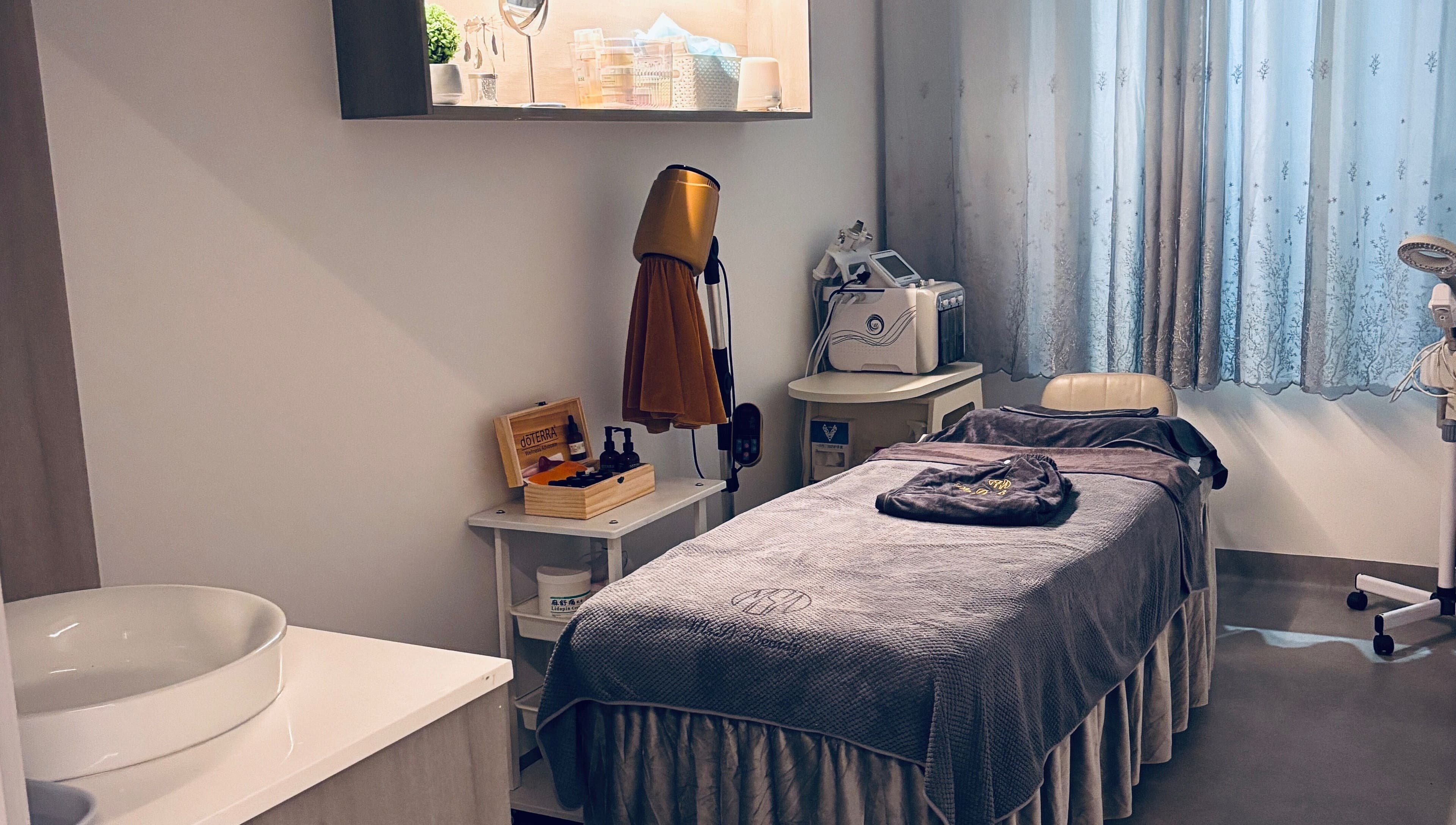 Ms.A Beauty serene spa room in Meadowbank, New South Wales, AU featuring a cozy treatment bed and soothing decor.