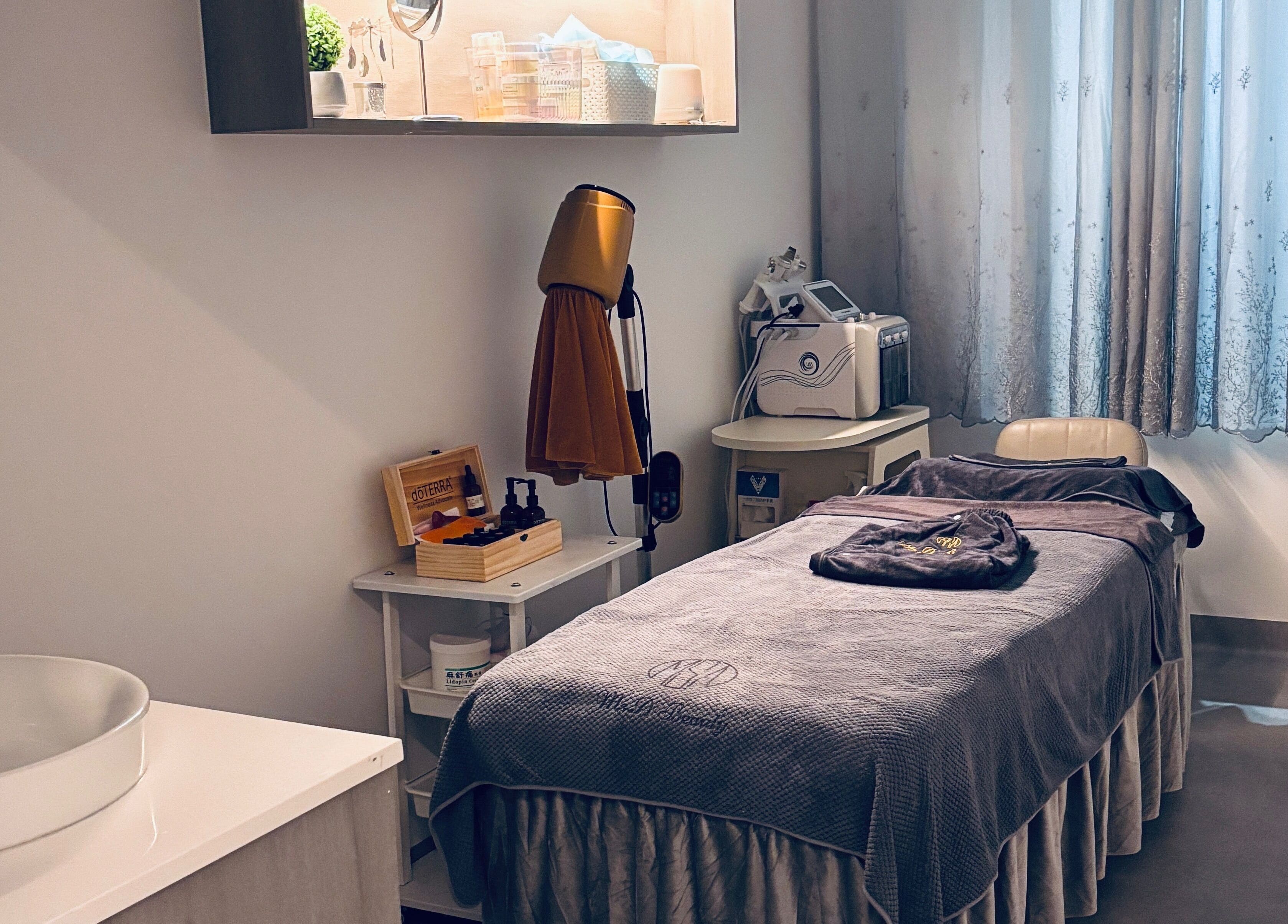 Ms.A Beauty serene spa room in Meadowbank, New South Wales, AU featuring a cozy treatment bed and soothing decor.