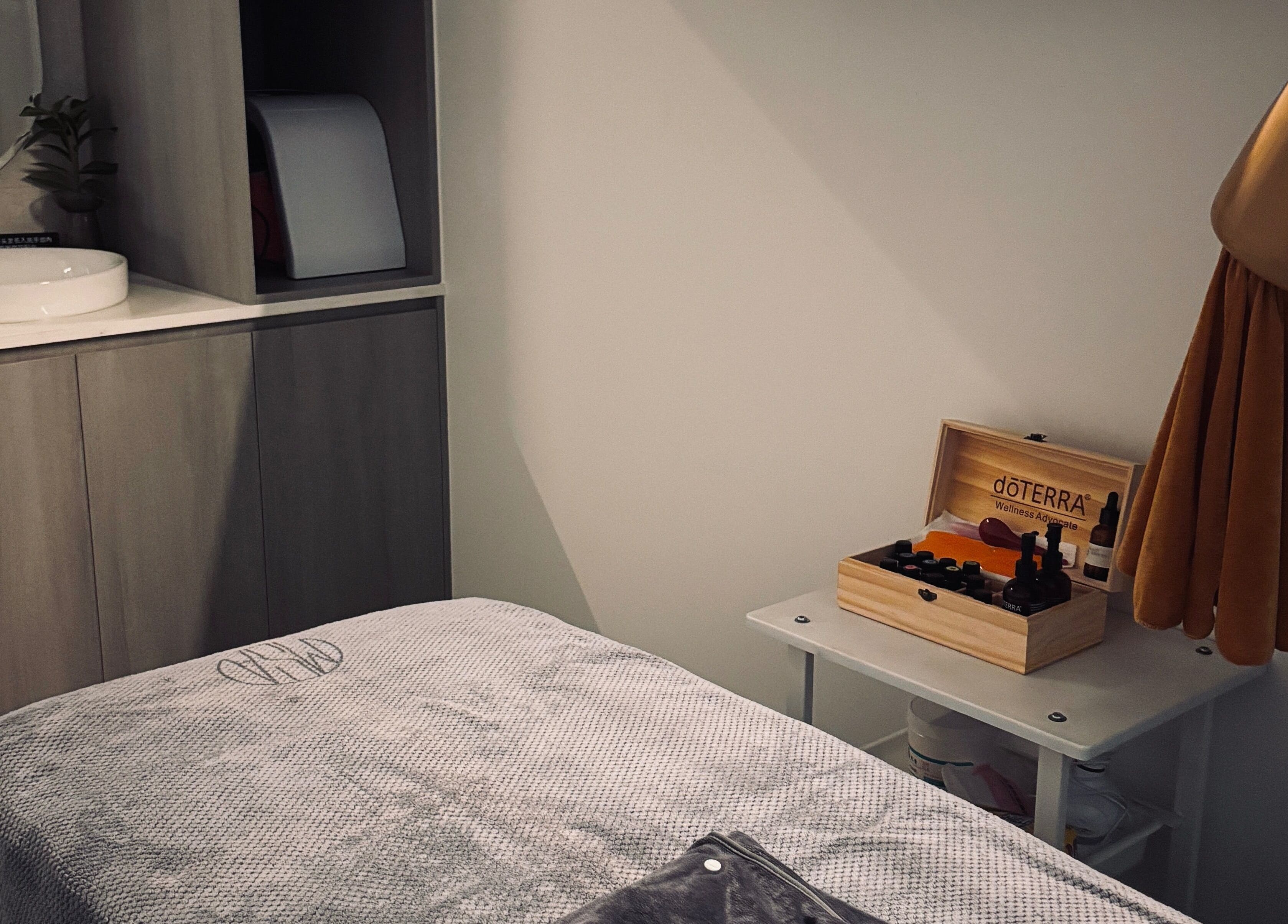 Relaxing treatment room at Ms.A Beauty in Meadowbank, New South Wales, AU with essential oils and cozy decor.