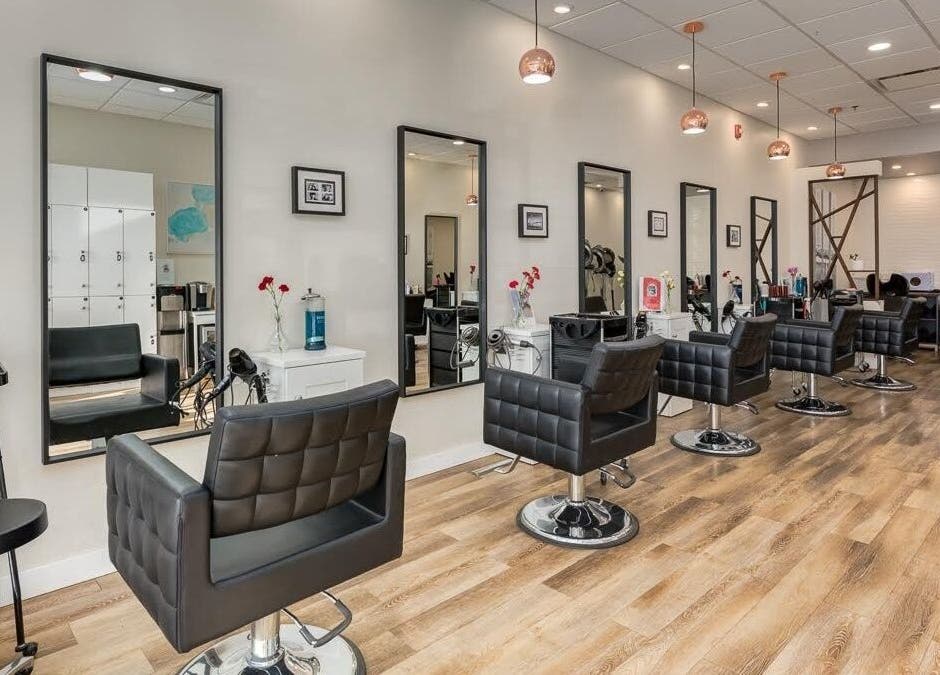Interior of London Hair Salon Macleod Trail in Calgary, Alberta, CA with stylish salon chairs and mirrors.