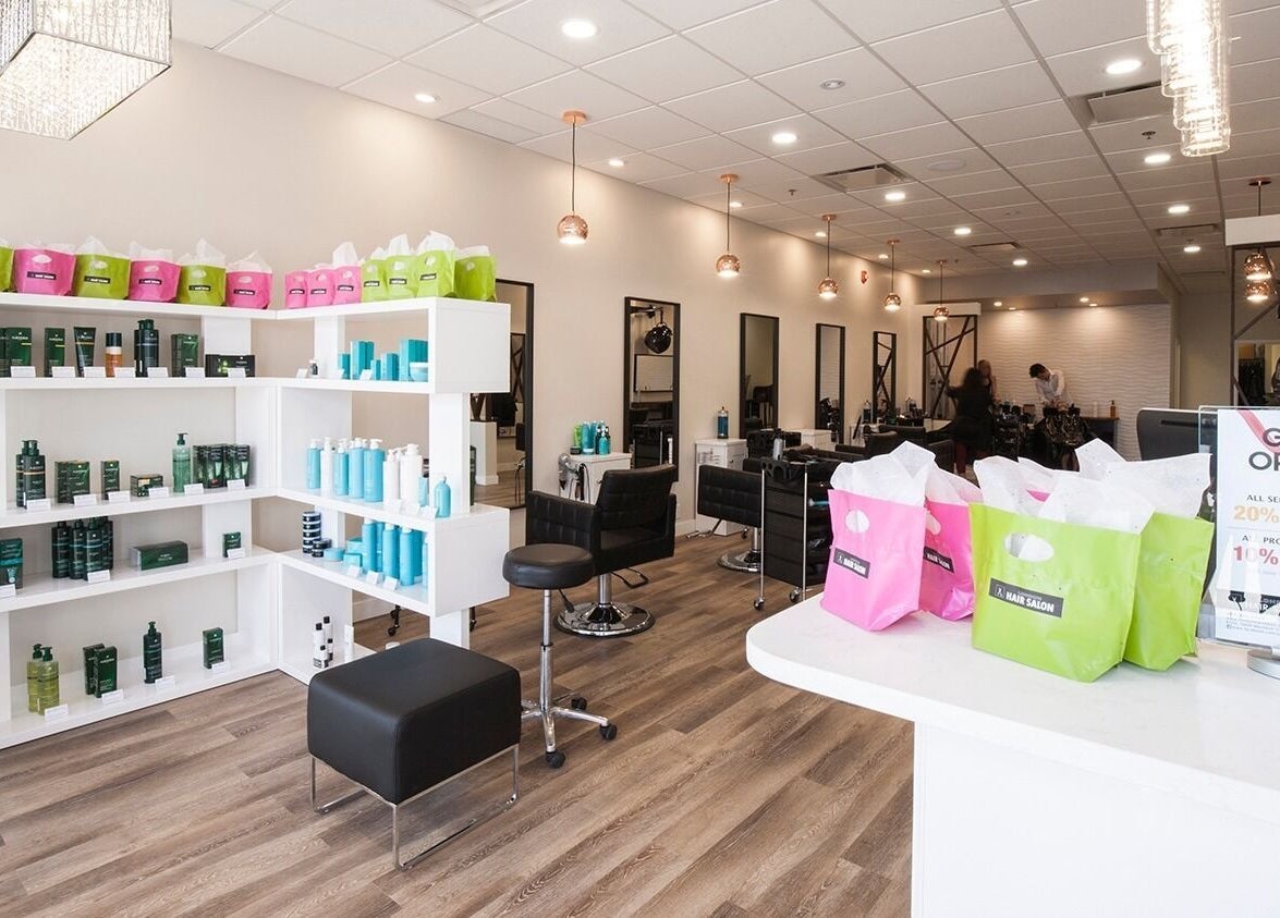 Inside view of London Hair Salon Macleod Trail, Calgary, Alberta, CA showcasing sleek décor and product shelves.