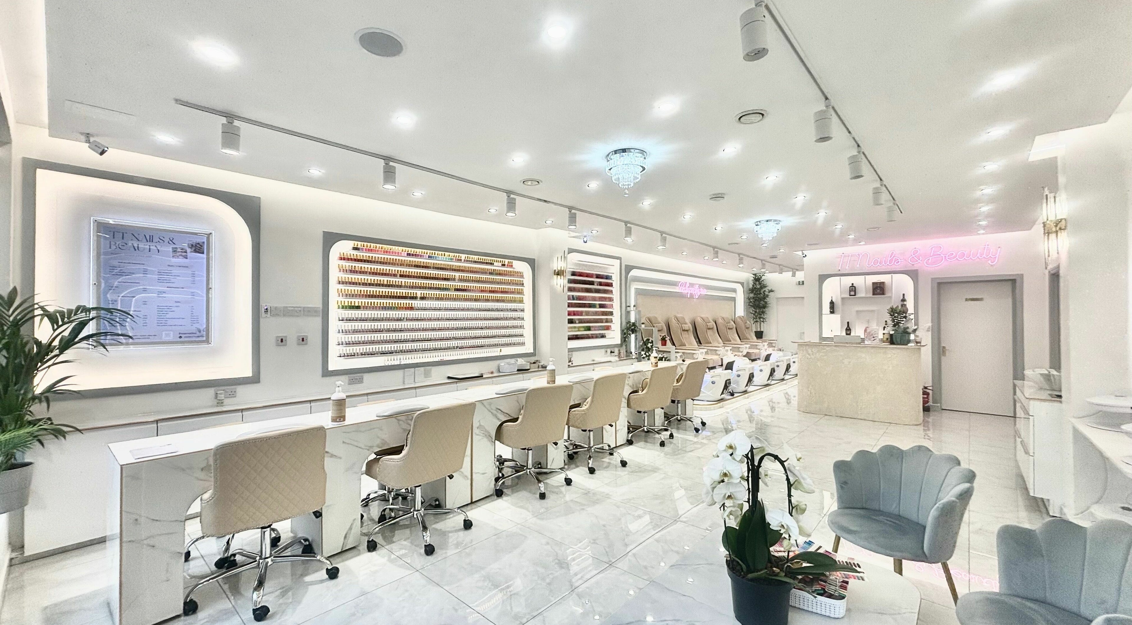 Spacious interior of TT Nails And Beauty Battersea in London, England, GB showcasing luxury nail stations.