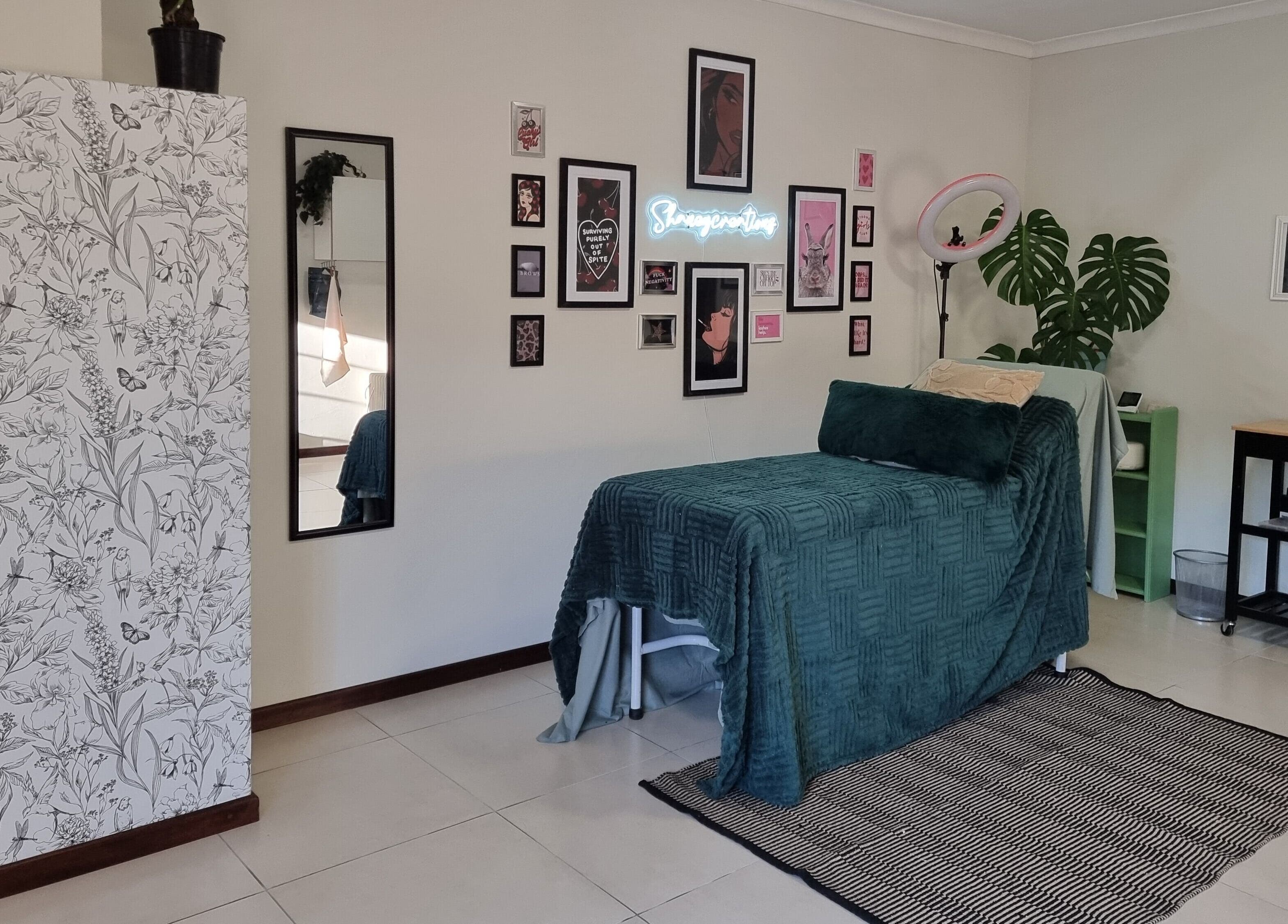 Relaxing spa room at BeholdHer, Gillitts, Kwazulu-natal, ZA with modern decor and wall art.