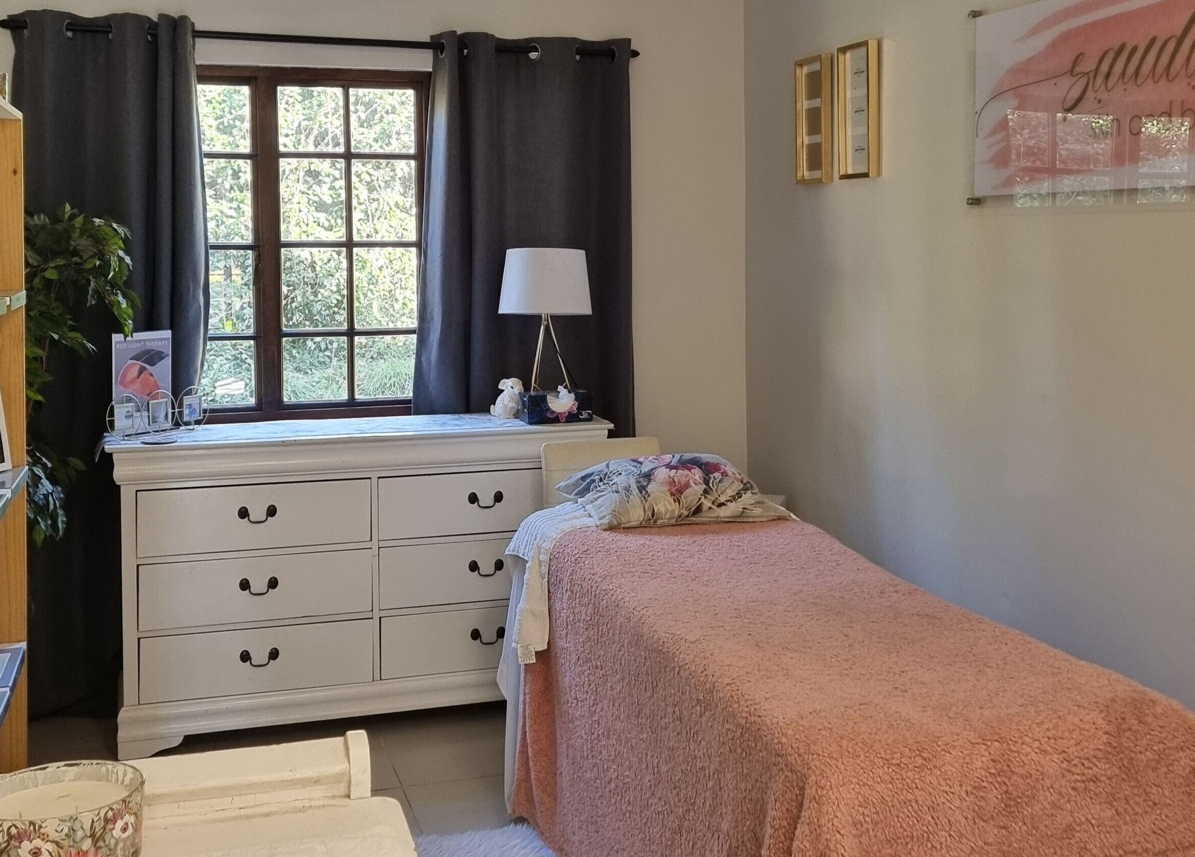 Cozy spa room at BeholdHer, Gillitts, Kwazulu-natal, ZA with a plush pink bedspread and calming decor.