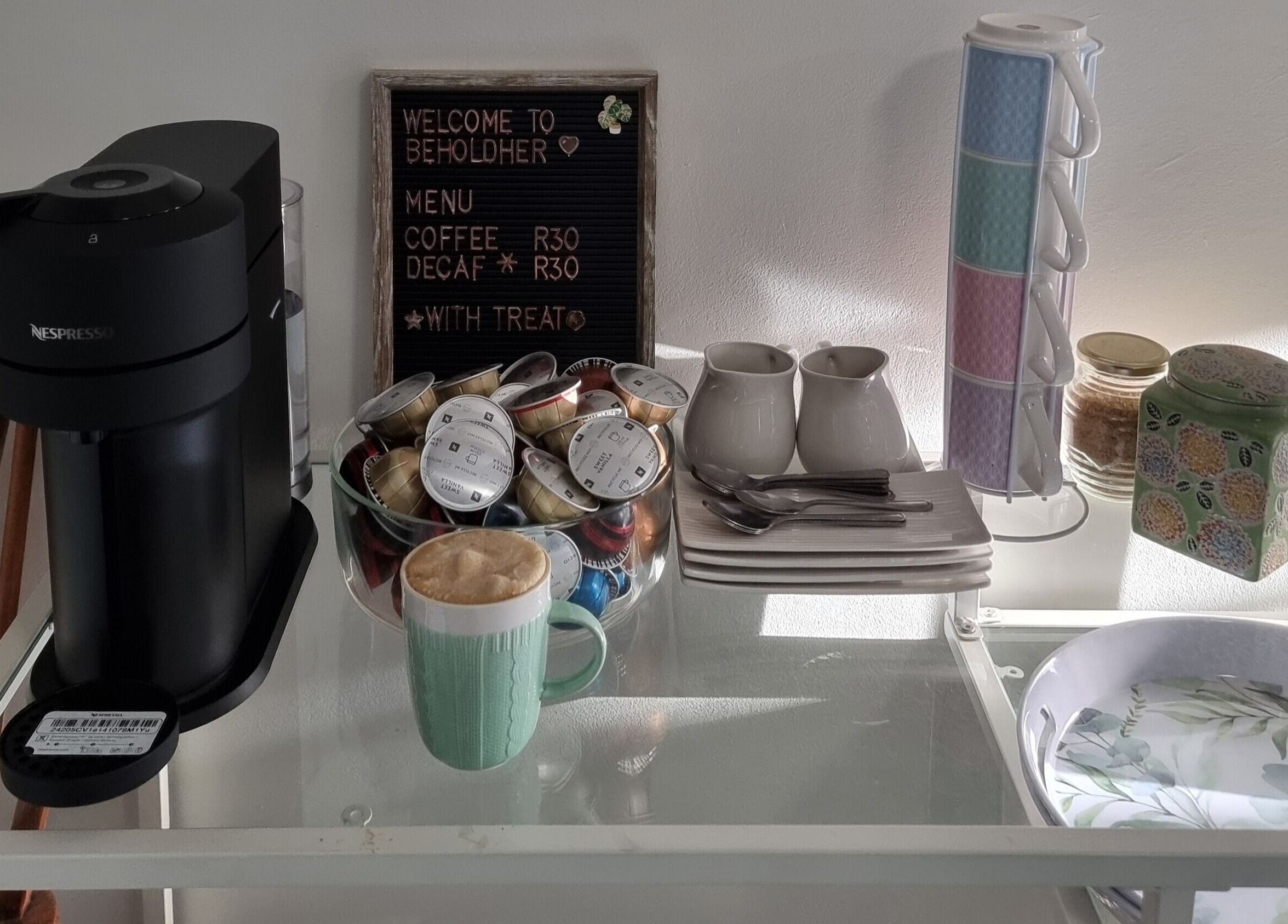 BeholdHer's cozy coffee nook in Gillitts, Kwazulu-natal, ZA offers Nespresso and a warm welcome.