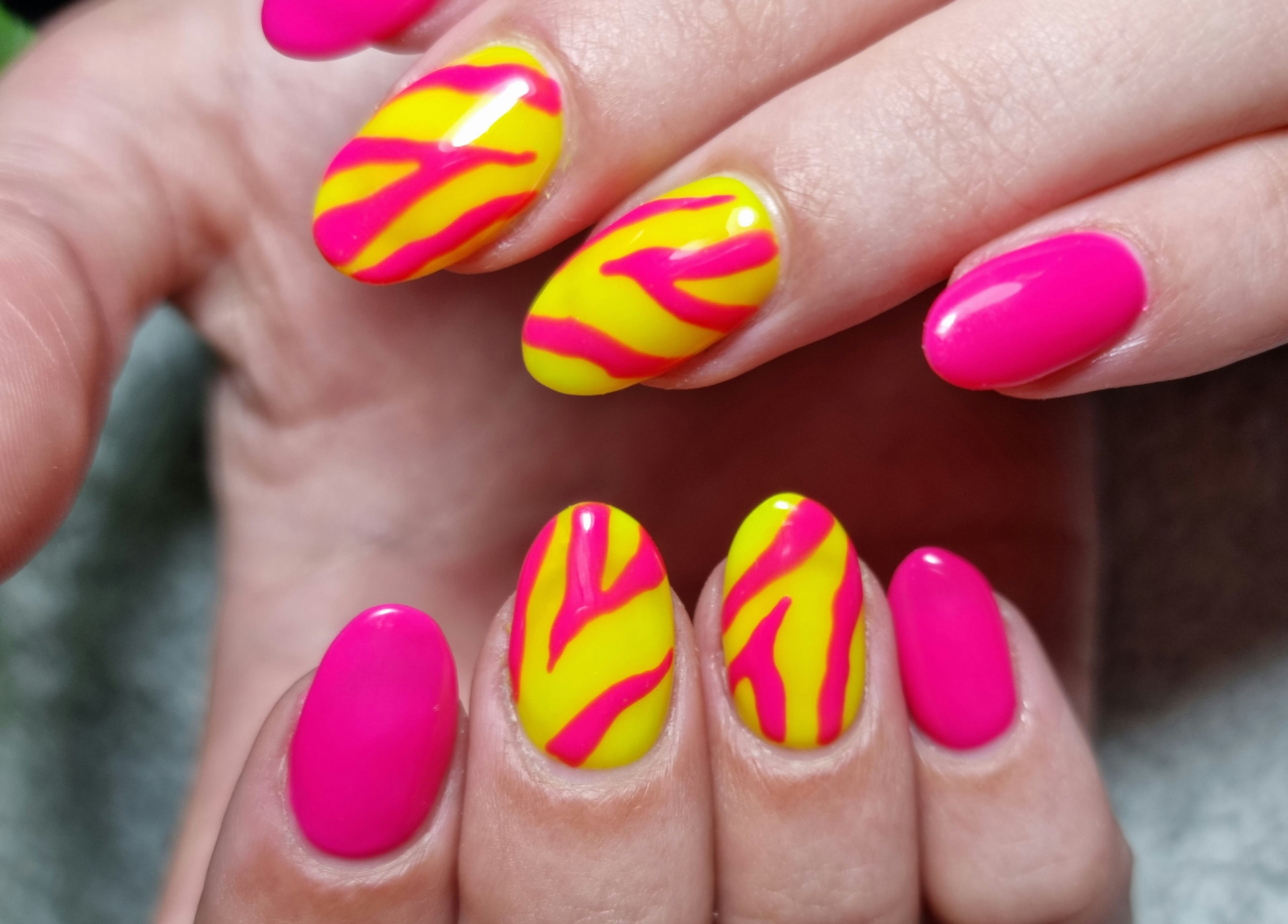 Colorful nail art with pink and yellow design at BeholdHer in Gillitts, Kwazulu-natal, ZA.