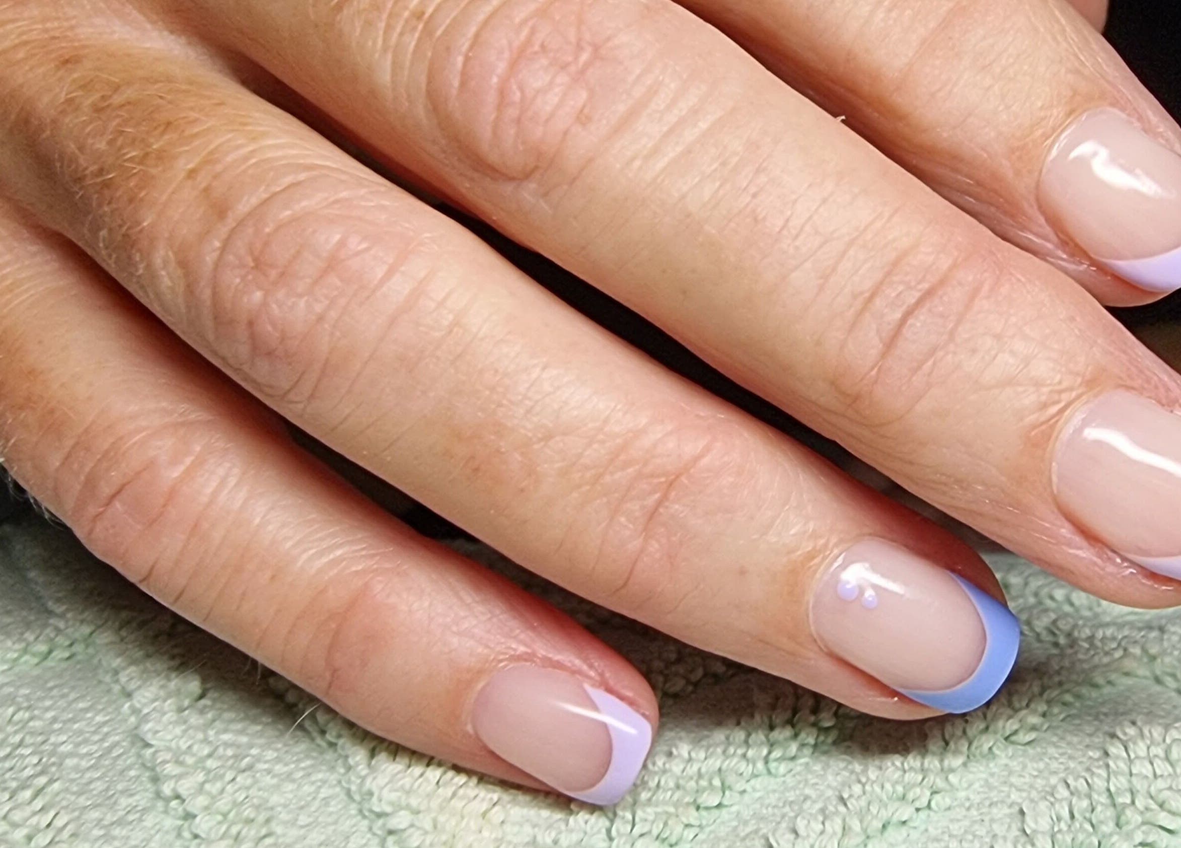 Elegant pastel French manicure at BeholdHer, Gillitts, Kwazulu-natal, ZA, showcasing expert nail art.