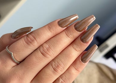 Elegant brown glossy nails at Khoi Pond Nails in Topsfield, Massachusetts, US.