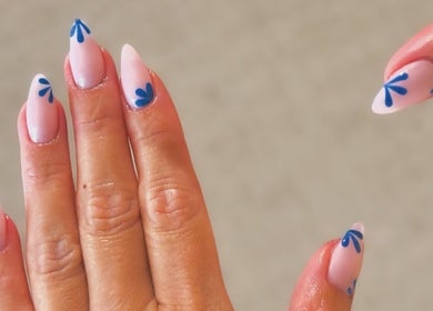 Elegant blue floral nail art from Khoi Pond Nails in Topsfield, Massachusetts, US.