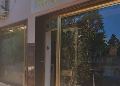 The Hair Fairy salon entrance with gold accents in Estepona, Andalucía, ES.