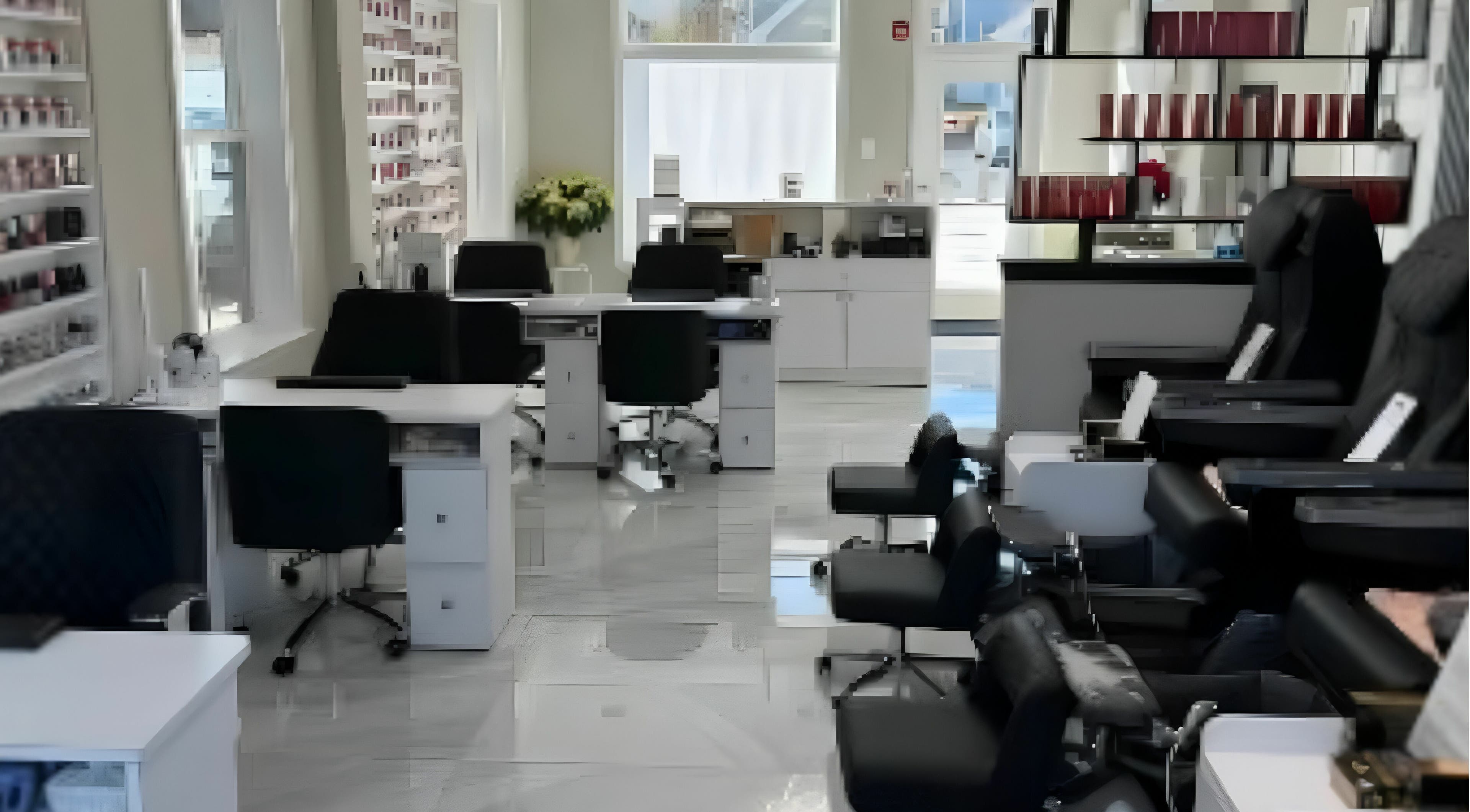 Interior of Queenie Nails & Spa in Frederick, Maryland, US, featuring modern manicure stations and plush pedicure chairs.