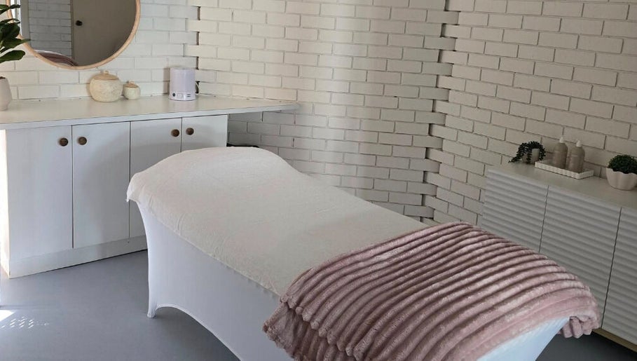 Tranquil treatment room at Skin and Beauty by Leah, Nambucca Heads, New South Wales, AU featuring a cozy bed.