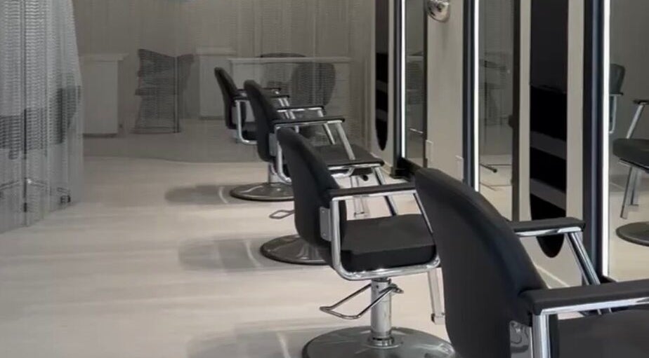 Modern salon chairs at FEMME LIKE YOU in Chicago, Illinois, US, showcasing a sleek interior design.