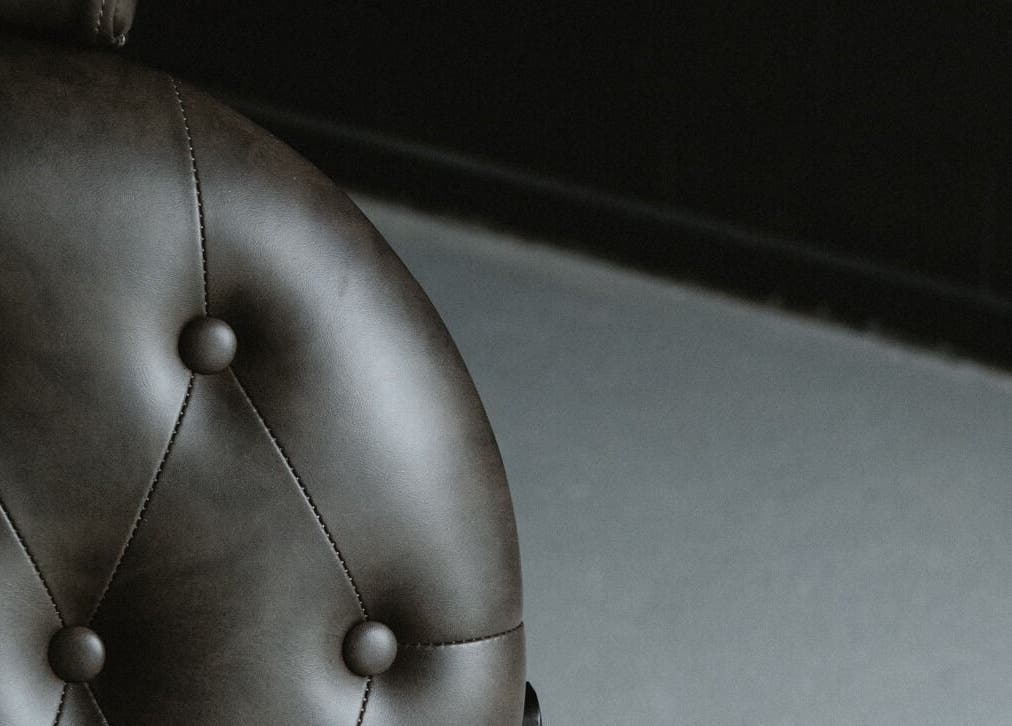 Elegant leather chair detail at Virtuoso Black, Melbourne, Victoria, AU offering luxury seating experience.