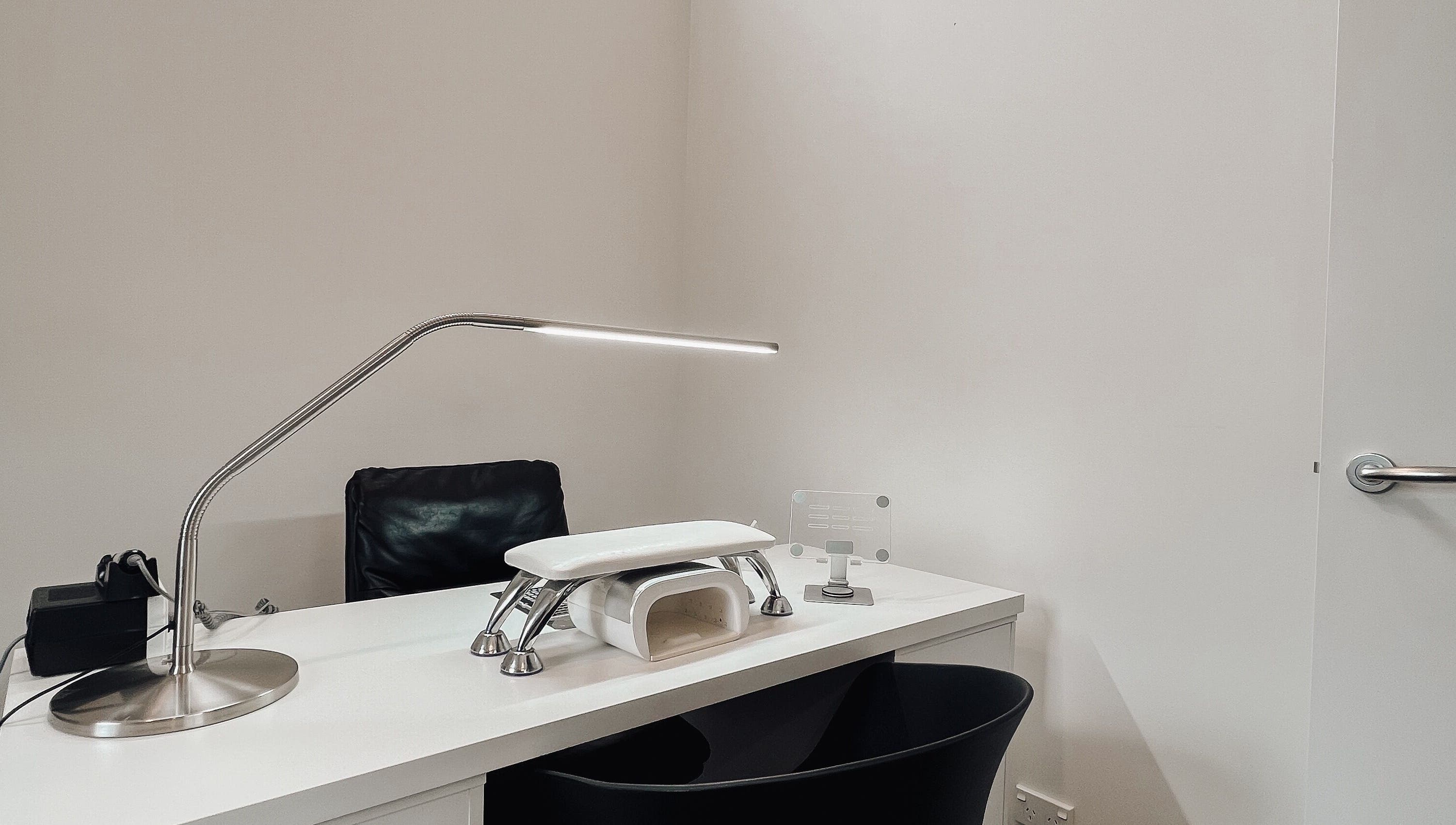 Minimalist workspace at Stren Beauty in Auckland, NZ, equipped for beauty treatments.