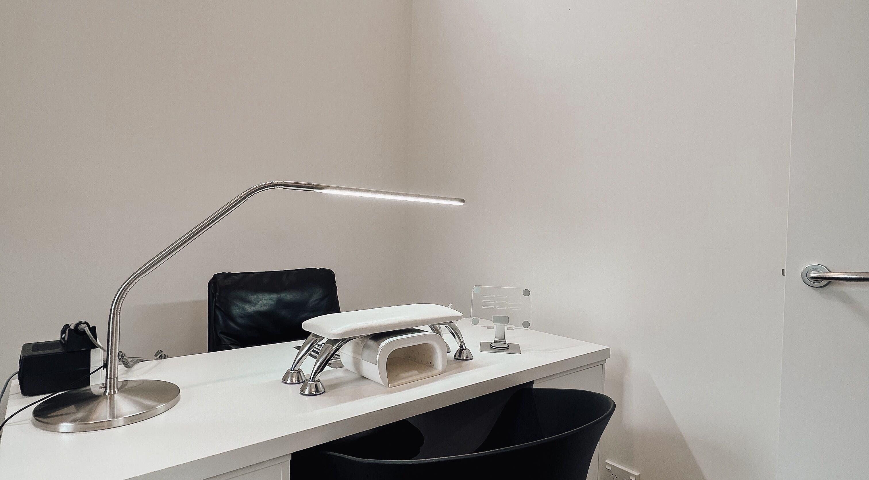 Minimalist workspace at Stren Beauty in Auckland, NZ, equipped for beauty treatments.