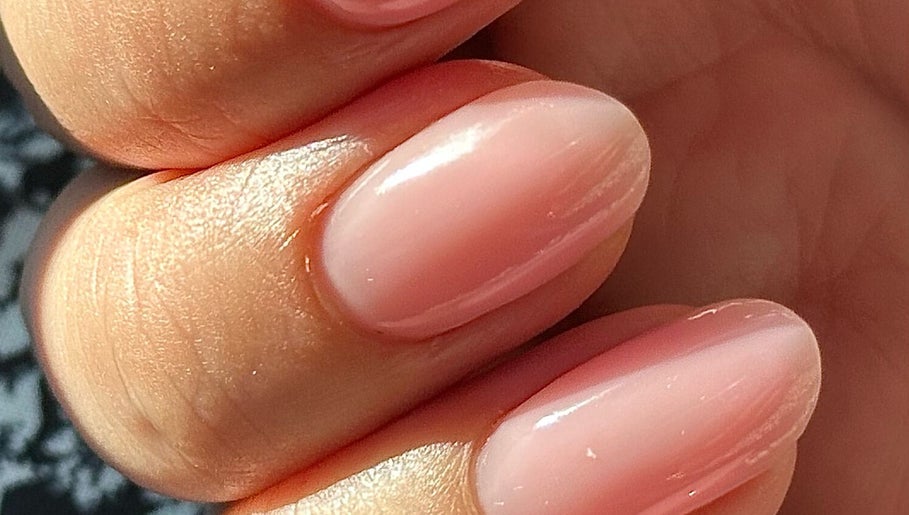 Glossy pastel pink nails at Nails by the Sea, Hartlepool, England, GB.